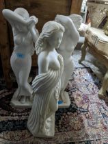 A group of contemporary resin Parian ware style conservatory statues of three semi-clad maidens on