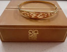 Clogau-A Welsh 9ct rose and yellow gold 'Tree of Life' hinged bangle having a filigree design with