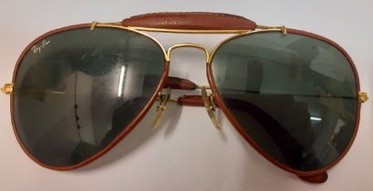 Rayban-A pair of 1980's 'Aviator Outdoorsman' sunglasses with brown leather and partial gold tone