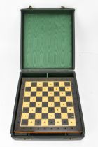 A 20th century games compendium, with wooden checkered board, resin chess pieces, dominos, and