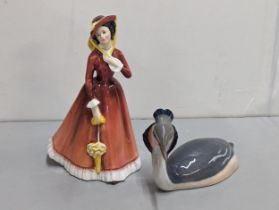 A Royal Copenhagen model Grebe bird No 3263 together with a Royal Doulton figure of a lady, Julia No