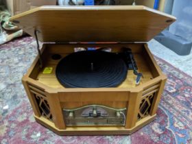 A vintage style wooden cased record player, radio and CD player Location:
