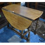 An Oak Drop Leaf Gate Leg Dining Table, 102cms Wide
