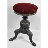 A Victorian Rise and Fall Music Stool, Circular Upholstered Top above Moulded Baluster Column,