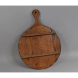 A 19th Century Treen Pie Peel or Spittle of Circular Paddle Form with Applied Rack for Spoons, 51cms