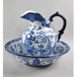 A Blue and White Transfer Printed Willow Pattern Toilet Jug and Bowl