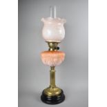 A Late 19th Century Brass and Opaque Glass Oil Lamp, Complete with Shade and Chimney, Reservoir with
