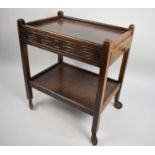 A Late 20th Century Oak Two Tier Trolley with Carved Design, the Square Supports Culminating Into