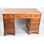 A Modern Desk with Tooled Top having Two Banks of Four Drawers Flanking Central Single Long