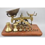 A Set of Brass Pan Scales on Wooden, C. Stephens of London, Fitted Plinth complete with Nine Weights