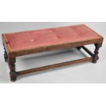 An Oak Framed Rectangular Stool with Tapestry Top, Short Barley Twist Supports with Stretcher Under,