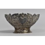 A White Metal Bonbon Dish of Oval Form with Floral Design Incorporating Birds and Heart