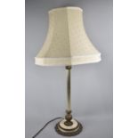 A Brass and Alabaster Base Table Lamp, Support of Reeded Column Form, Complete with Shade