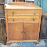 A Mid 20th Century Oak Tall Boy with Two Long Drawers Over Cupboard Base, Galleried Back, 94cms Wide