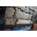 A 19th Century Oak Framed Camel Back Sofa with Tapestry Upholstery Raised on Scrolling Supports