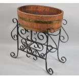 A Coppered Oval Planter on Wrought Iron Stand