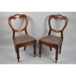 A Pair of Victorian Mahogany Balloon Back Dining Chairs with Turned Front and Splayed Backs Supports