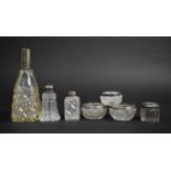 A Collection of Four Silver Mounted and Topped Glass Bottles Together with a Single and a Pair of