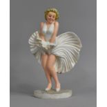 A Reproduction Cold Painted Cast Metal Door Stop in the Form of Marilyn Monroe, 34cm high