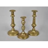 A Collection of Three 19th Century Brass Candlesticks
