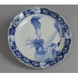 An Oriental Blue and White Porcelain Plate decorated with Exterior Scene with Mountains, River and