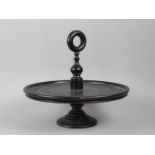A Late Victorian Ebonised Lazy Susan, with Ring Carrying Handle, 33cms Diameter