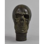 A Reproduction Patinated Bronze Walking Cane Handle in the Form of a Human Skull, 7.5cm high