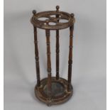 A Late Victorian/Edwardian Circular Four Section Stick Stand with Turned Supports, Metal Drip Tray