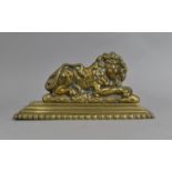 A Late Victorian Brass Doorstop in the Form of a Reclining lion on Stepped Plinth Base, 20cms Wide