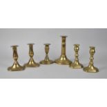 A Collection of Two Pairs and Two Single Brass Candlesticks, 19th Century, Tallest 19cm