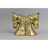 A Pair of Modern Brass Bookends in the form of Horses Heads, 18cms High