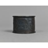 An Arts and Crafts Oxidised Napkin Ring decorated in Foliate Relief in the Manner of Newlyn, 5cms