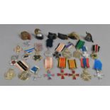 A Collection of Pressed Metal Miniature Military Hats and Military Medals