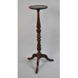 An Edwardian Turned Mahogany Tripod Torchere Stand, 28cms Diameter and 99cms High