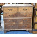 A Burr Walnut Chest of Two Short and Three Long Drawers with Bracket Feet, String Inlaid Top (Top