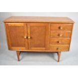 A 1970's Sideboard with Four Side Drawers and Cupboard, 121cm wide