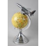 A Vintage Desk Top Novelty in the Form of Jet Aircraft Flying Over Globe, 30cms High