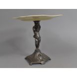 A WMF Silver Plated Tazza Stand in the Form of a Cherub with Unrelated Ceramic Side Plates, 21cms