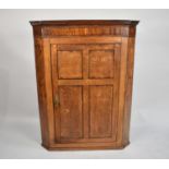 A 19th Century Oak and Mahogany Wall Hanging Corner Cabinet with Panelled Doors to Shelved Interior,