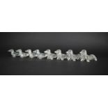 A Collection of Eight Clear Plastic Knife Stands in the Form of Dachshunds