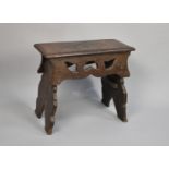 An Early Oak Rectangular Topped Stool with Pierced Side Panels, Top 50cms by 23cms