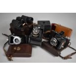 A Collection of Various Vintage Cameras to comprise Zeiss Ikon Bellows Camera together with a pair