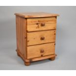 A Single Pine Bedside Three Drawer Chest, 43cms Wide