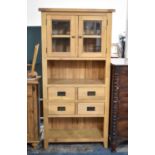 A Modern Hardwood Kitchen Cabinet with Four Centre Drawers, Shelved Spaces Above and Below and