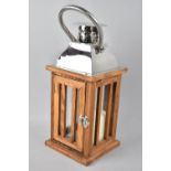 A Modern Wooden and Chrome Candle Lantern, 35cms High