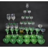 A Collection of Various Opaque Green Stemmed Drinking Glass and Bowls