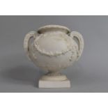 A 19th Century Parian Study of a Two Handled Vase with Relief Swag and Floral Decoration, Missing