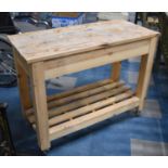 A Rectangular Pine Table/Island with Slatted Stretcher Under on Castors, 102cms Wide