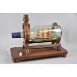 An Early/Mid 20th century Table Lamp in the Form of a Ship in a Bottle, 29cms Wide