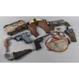 A Collection of Vintage Toy Guns and Holsters